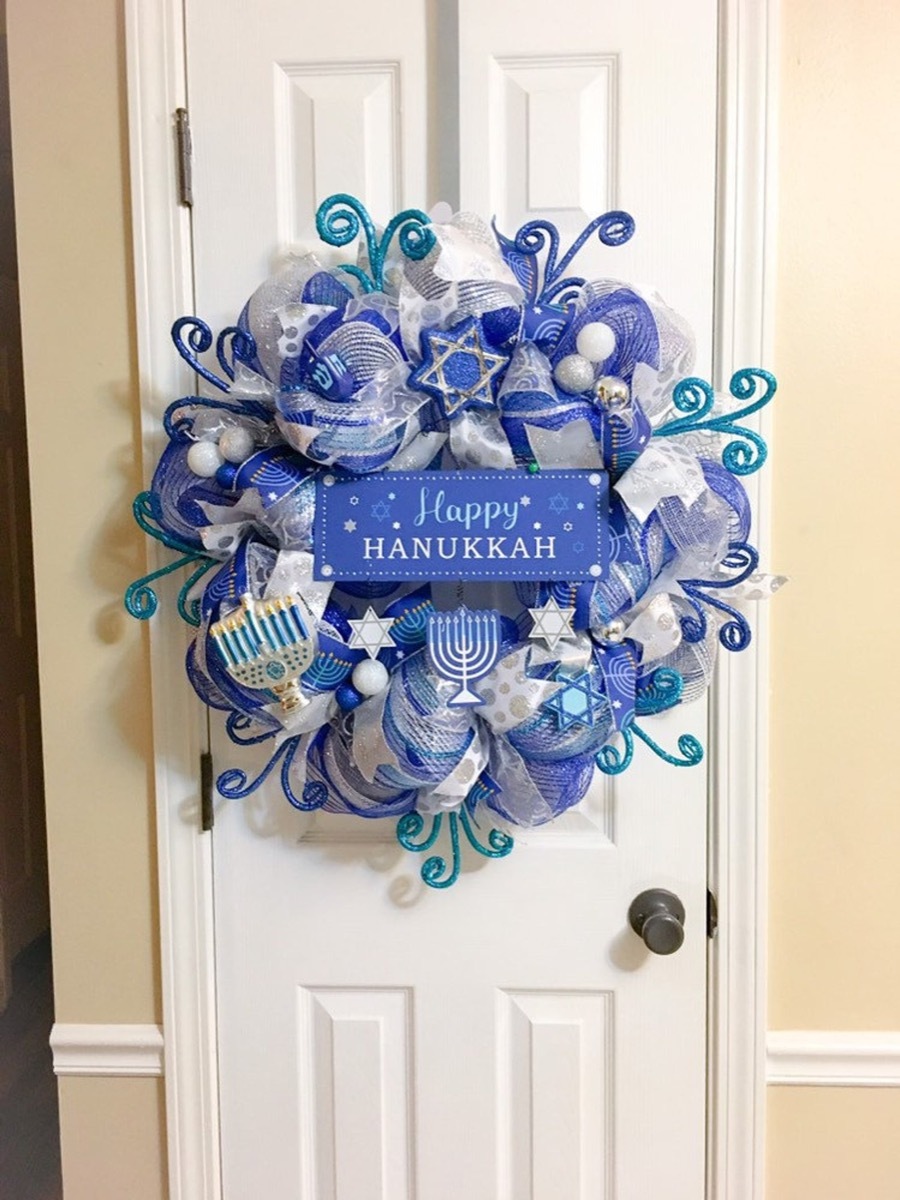 blue hanukkah wreath on white door, hanukkah decorations