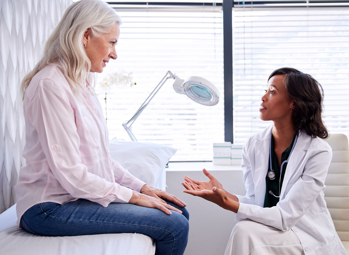 female physician advising female patient