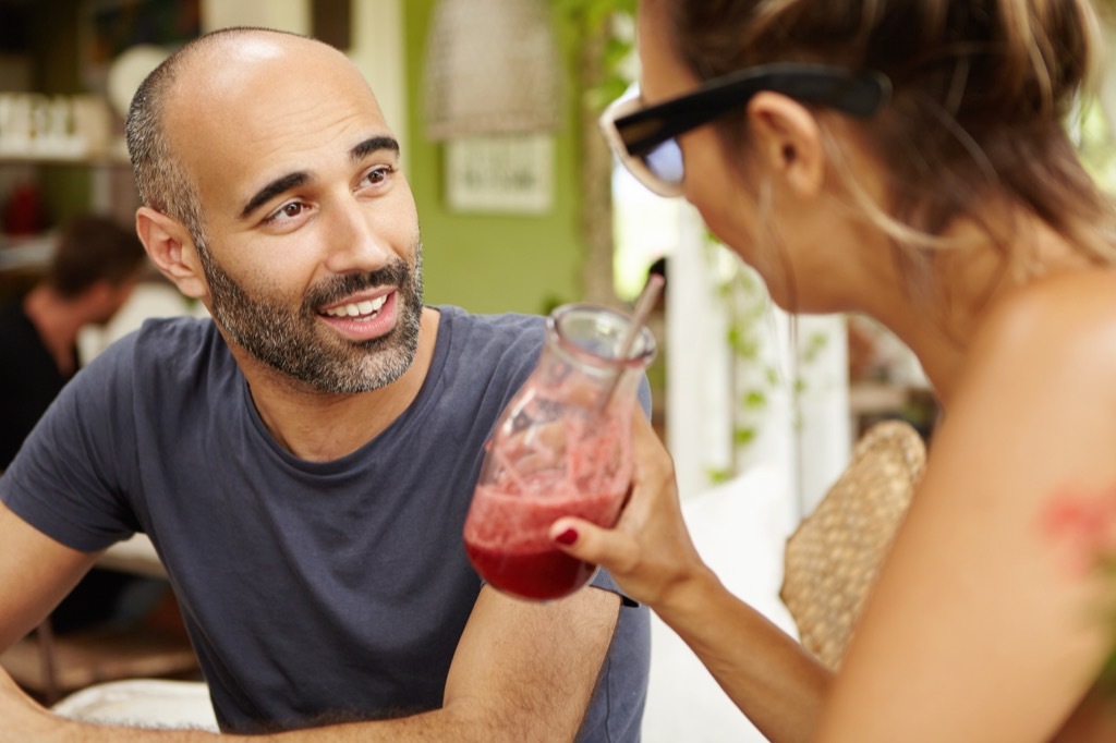 man and woman talking with smoothies, open marriage