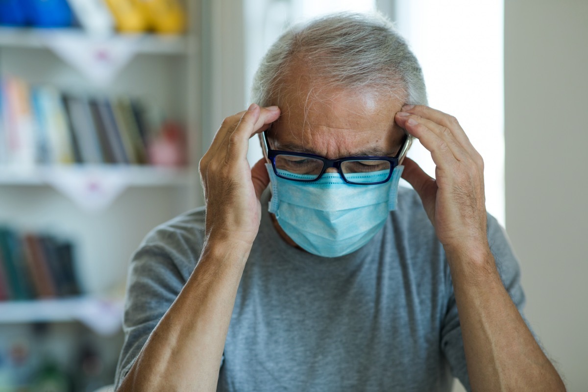 Worried mature man having a headache