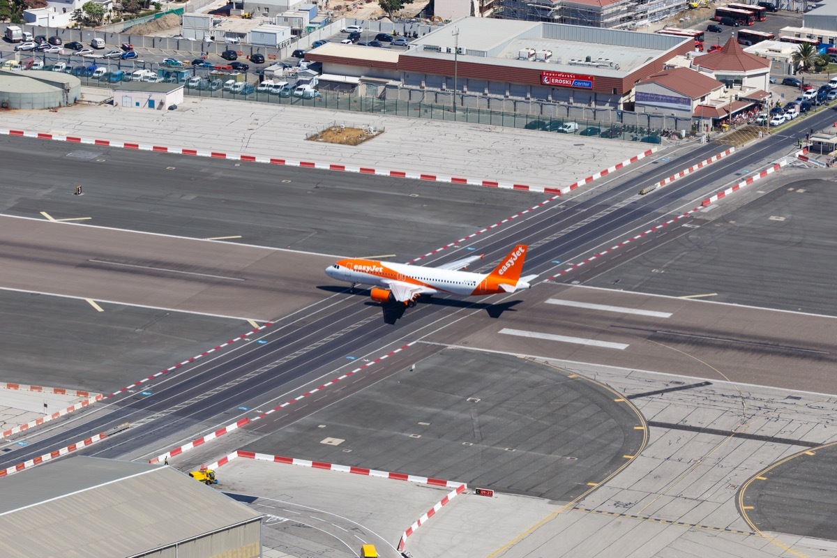 gibraltar airport that has a highway going through it