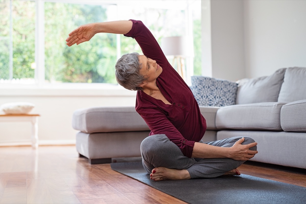 woman exercising at home, over 40 fitness