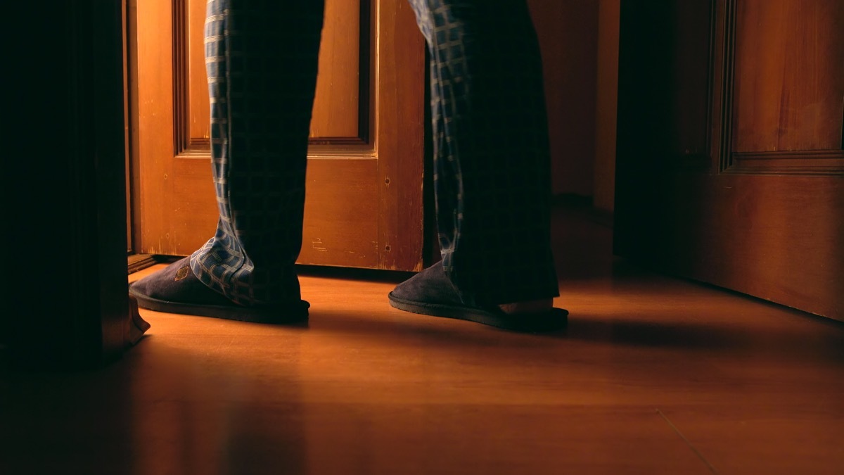 Man walking into bathroom