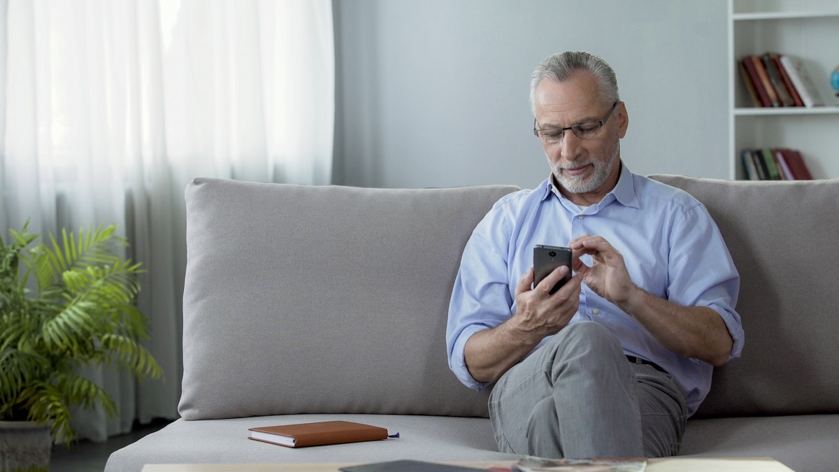 Older man using cellphone