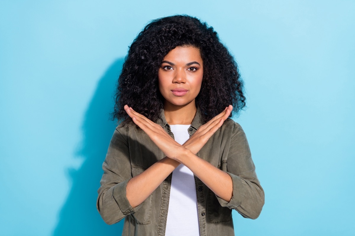 Woman Making X with Hands