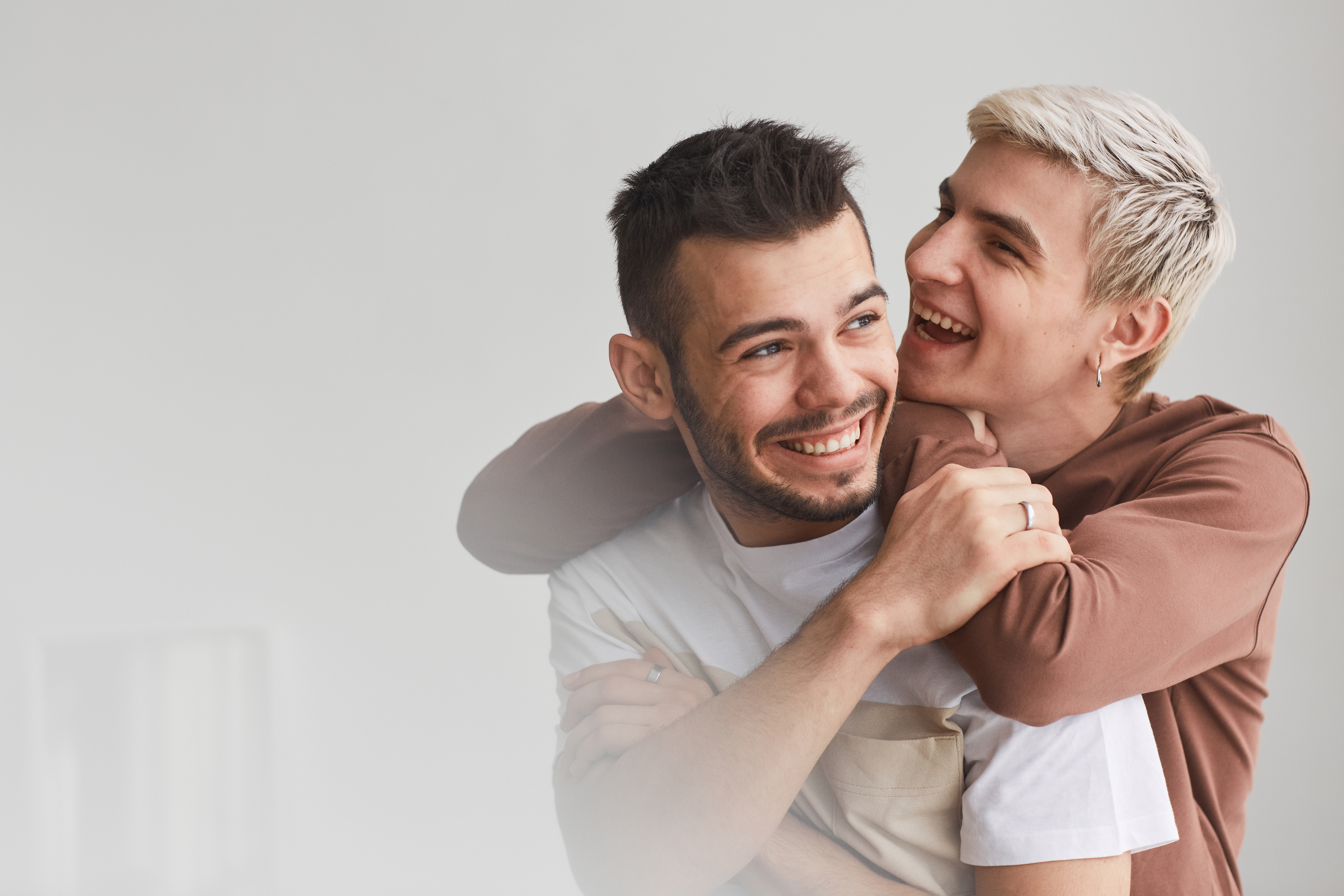 couple smiling and embracing