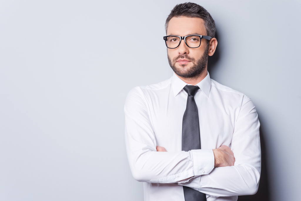 Man with No Smile and Crossed Arms Reading Body Language