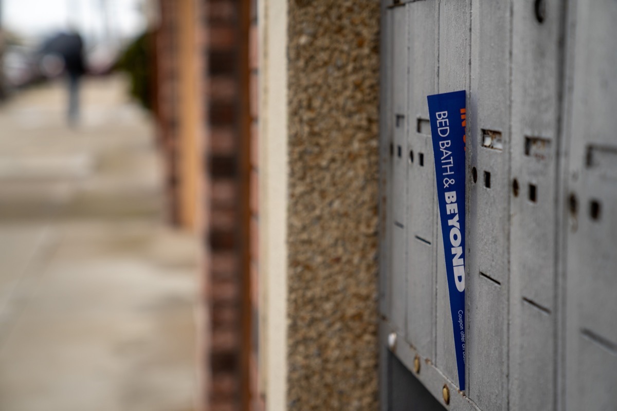 Bed bath beyond coupon discount flyer hanging outside of residential mailbox