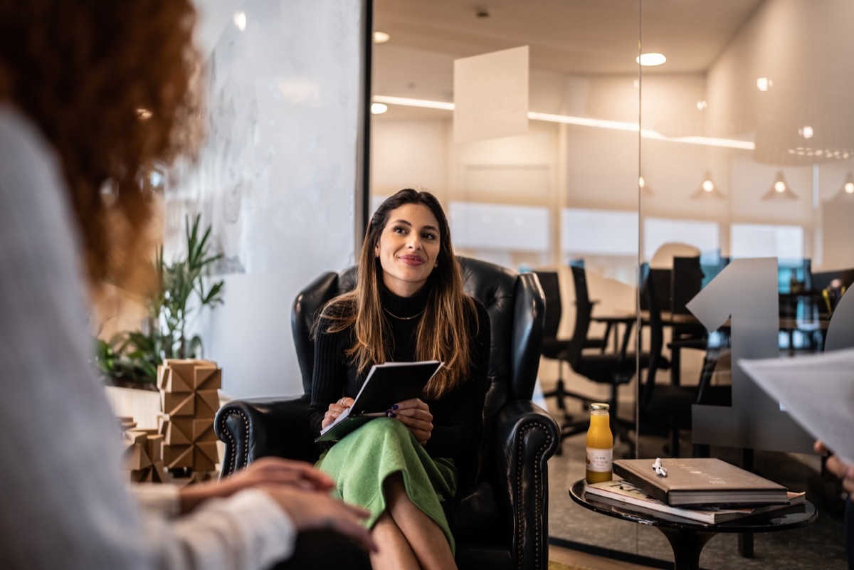 Young woman in a meeting with coworkers at the office