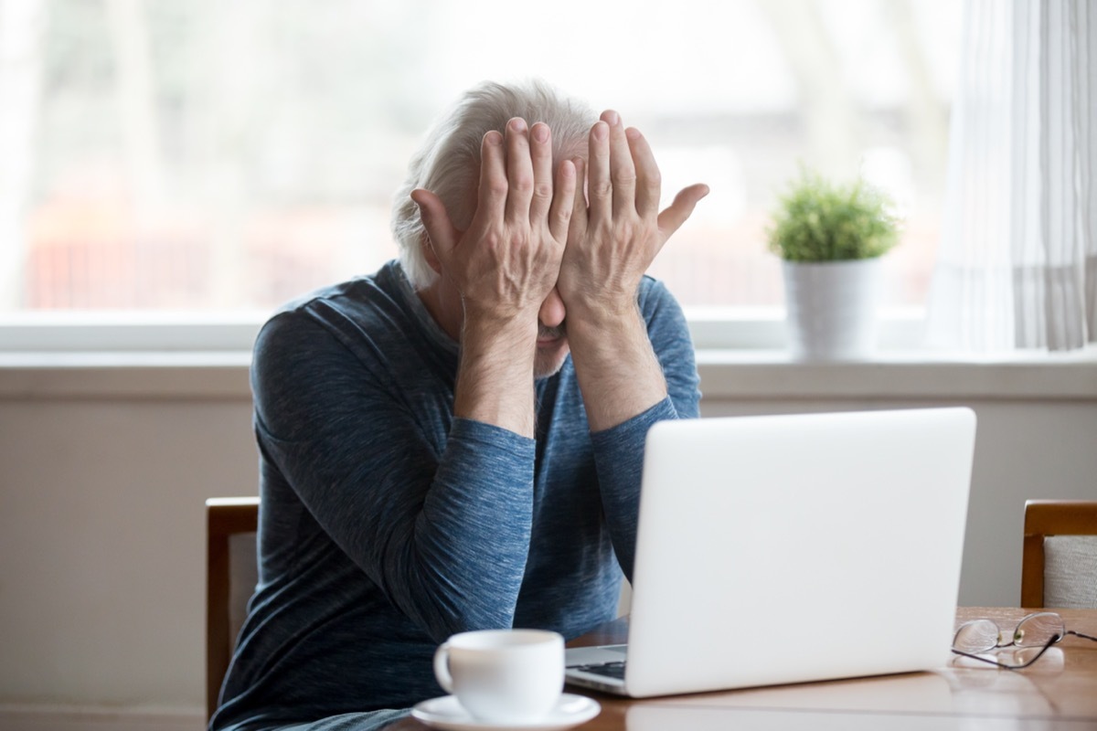 Fatigued senior mature man eyestrain can't see