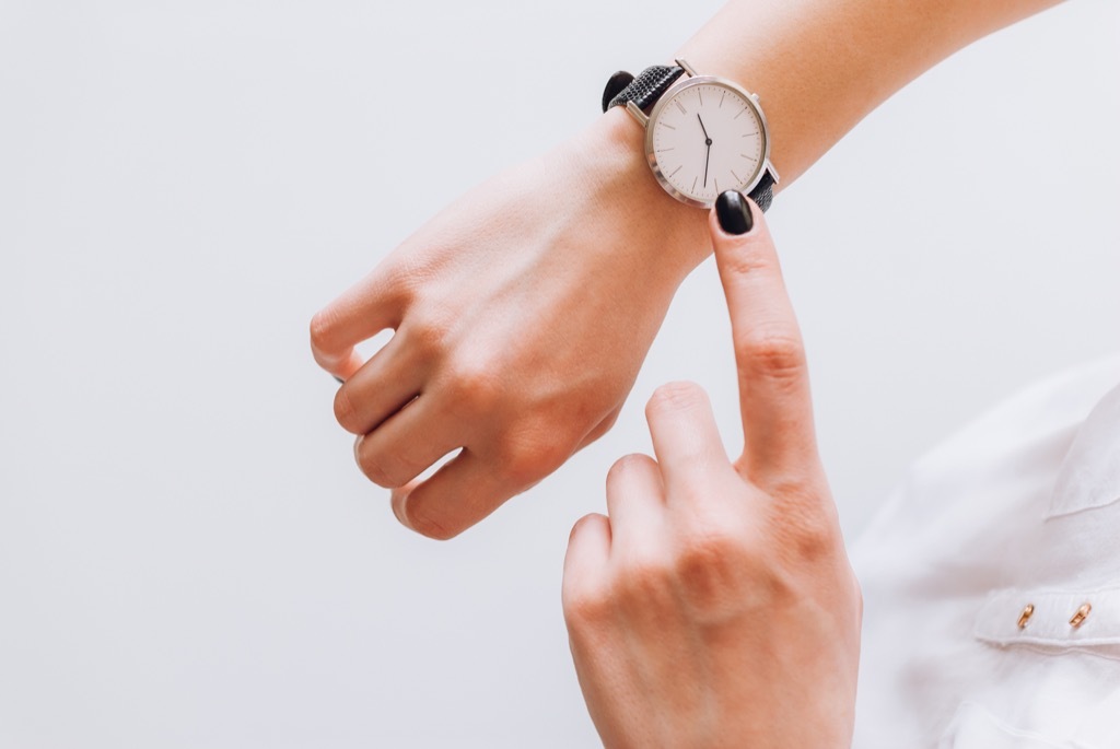 woman checking watch, parent divorce