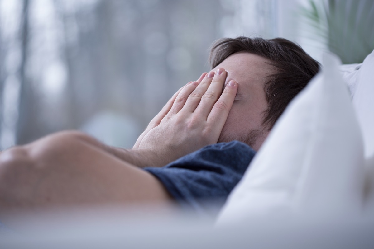 Man having some sleeping disorders like insomnia