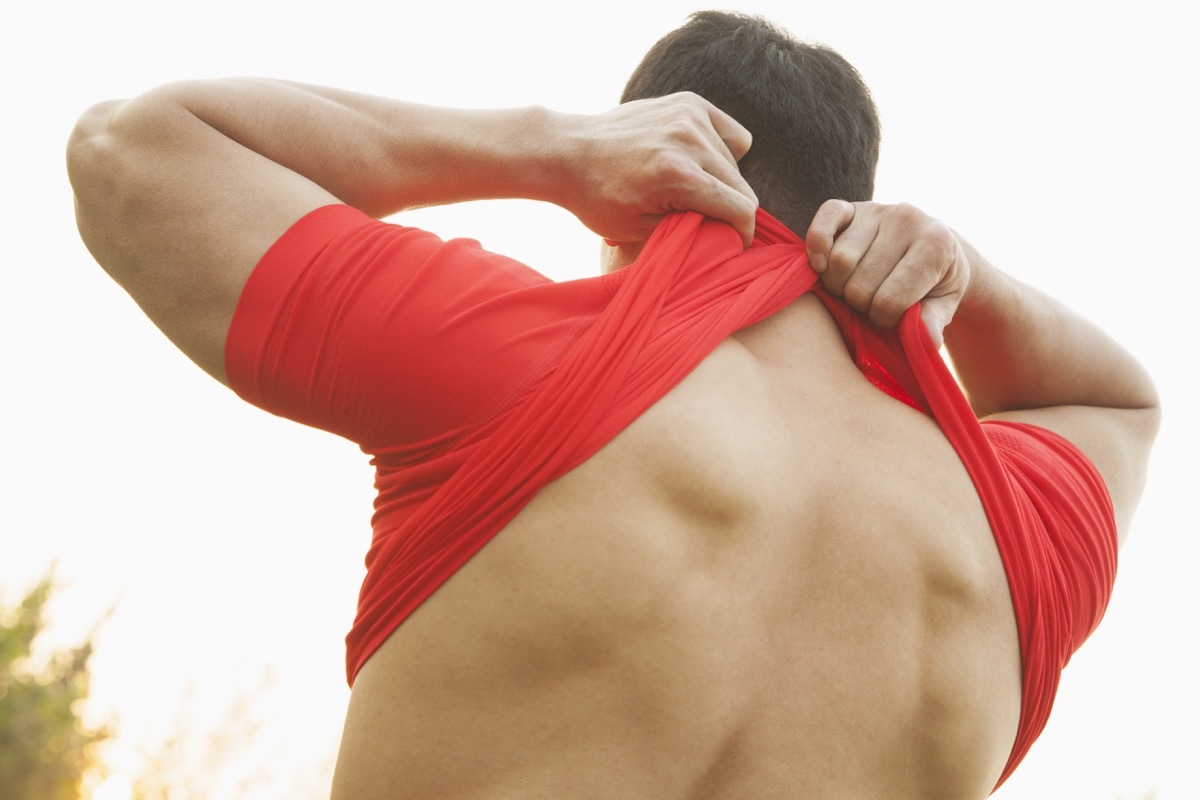 man taking off his shirt to turn inside out, weird state records