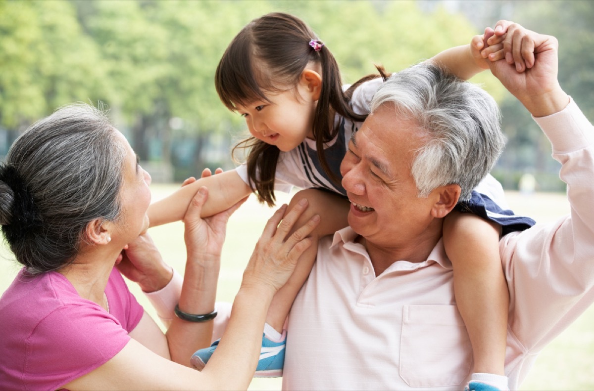 two asian grandparents with granddaughter on their shoulders, best gifts for grandparents