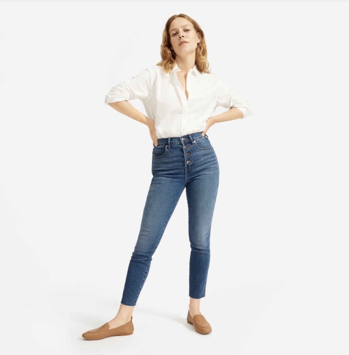 woman in high rise blue jeans