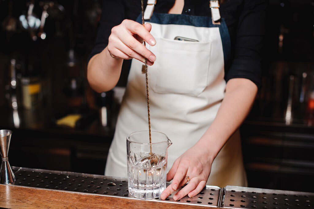 bartender stirring martini