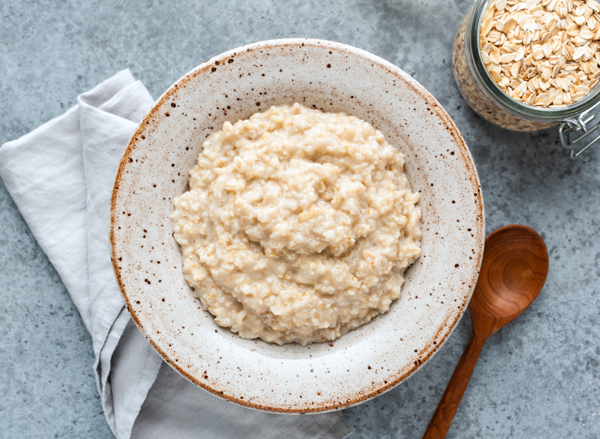 Plain bowl of oatmeal and raw oats