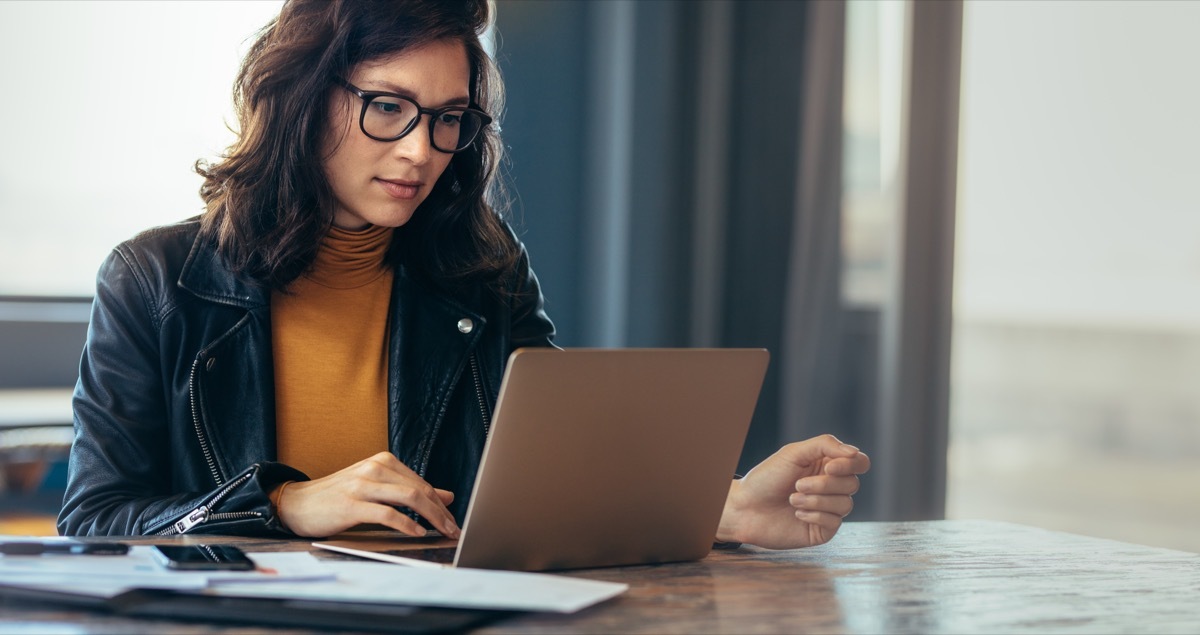 Woman online shopping on Cyber Monday with laptop