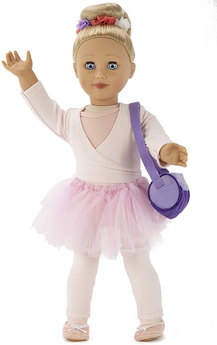 ballerina doll in pink outfit with purple bag