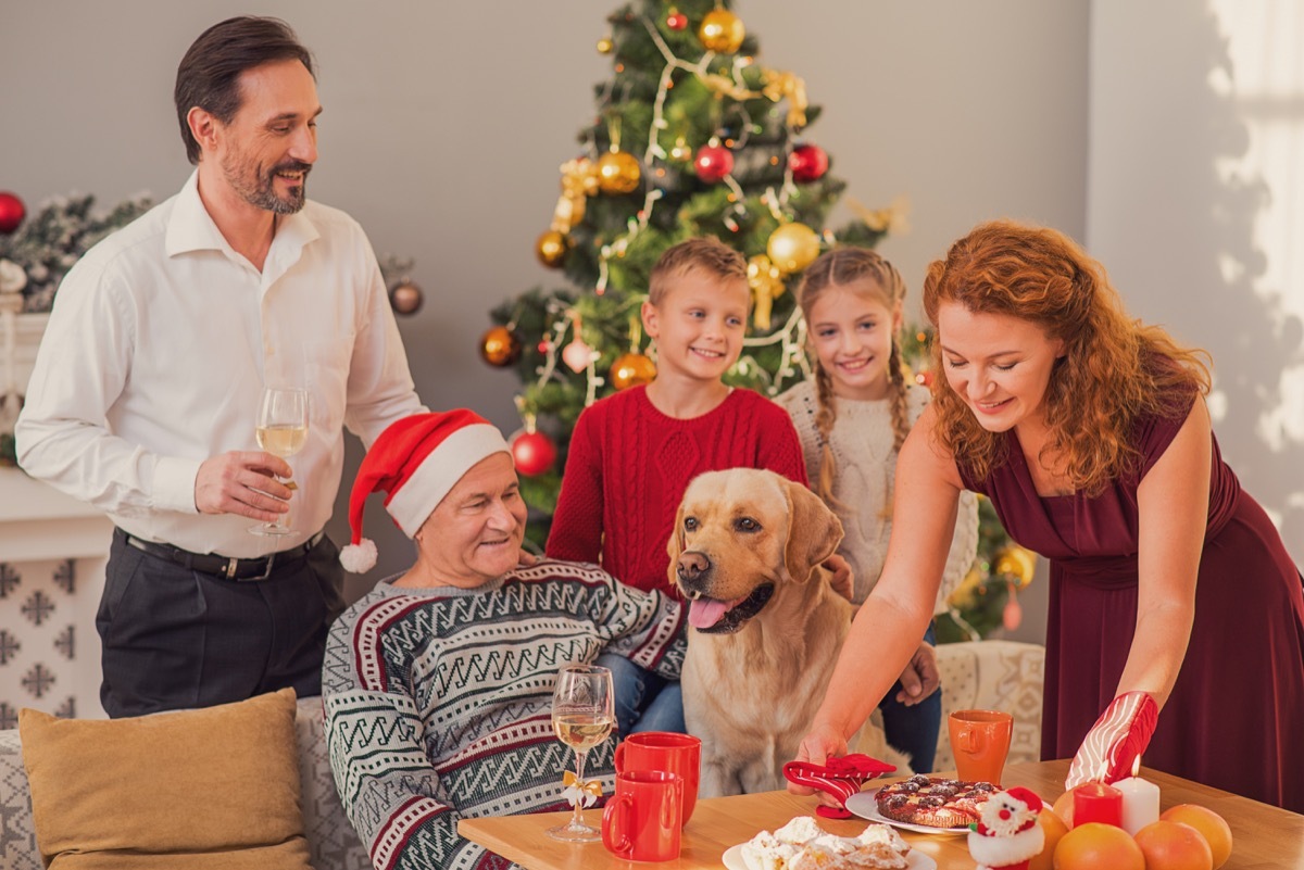 family with dog celebrating new years