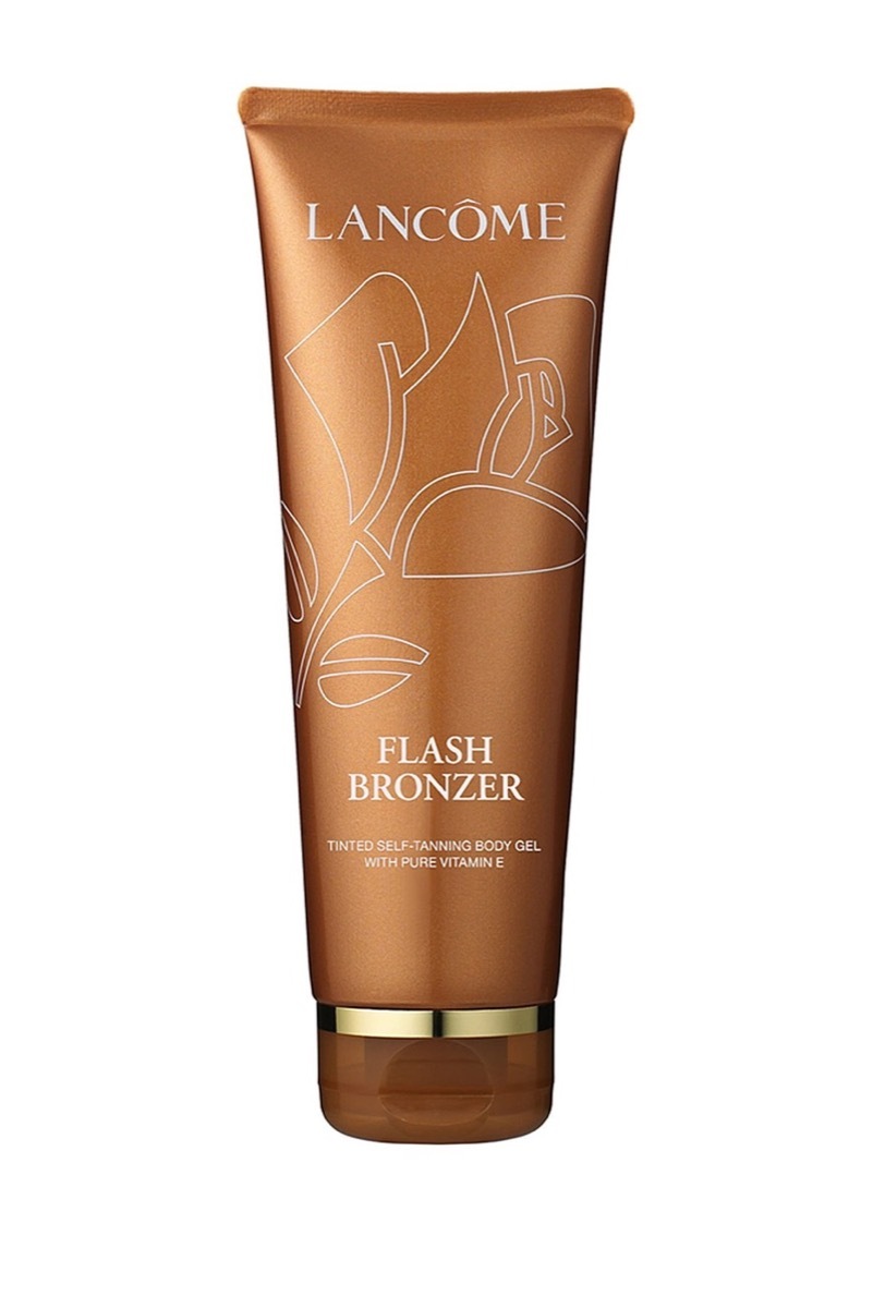 Bottle of Lancome bronzer on white background