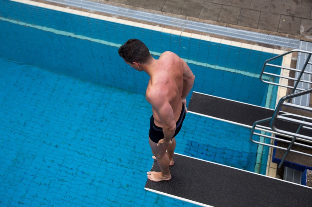 Man with a fear of heights on the diving board