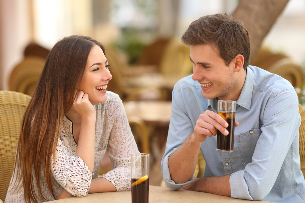 happy couple smiling on a date