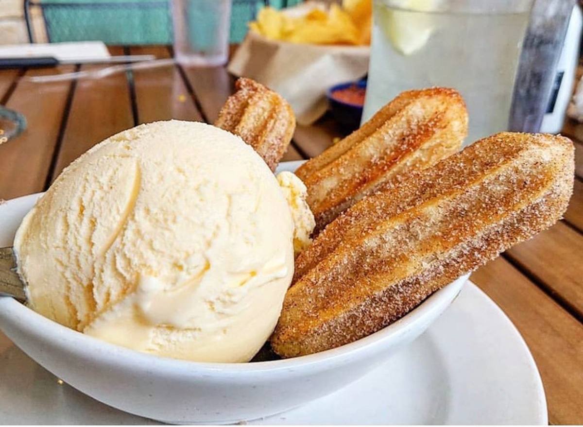 on the border caramel churros with vanilla ice cream scoop