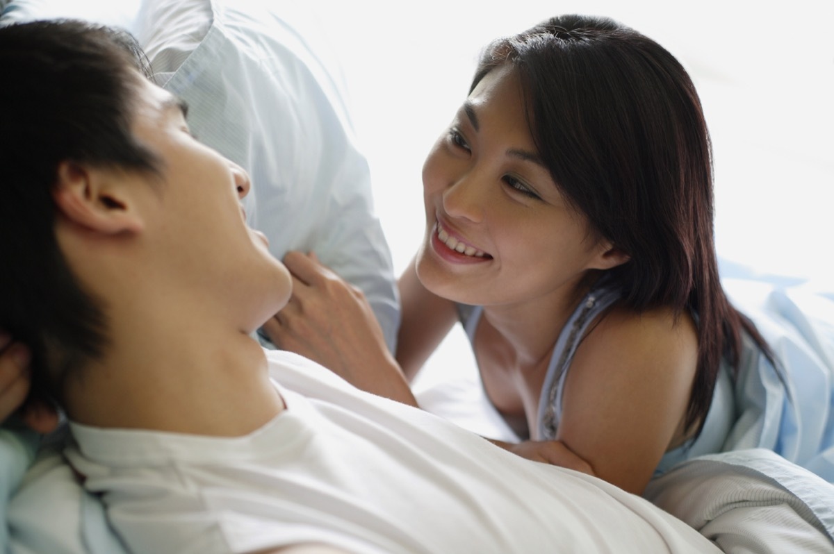 Couple together in bed