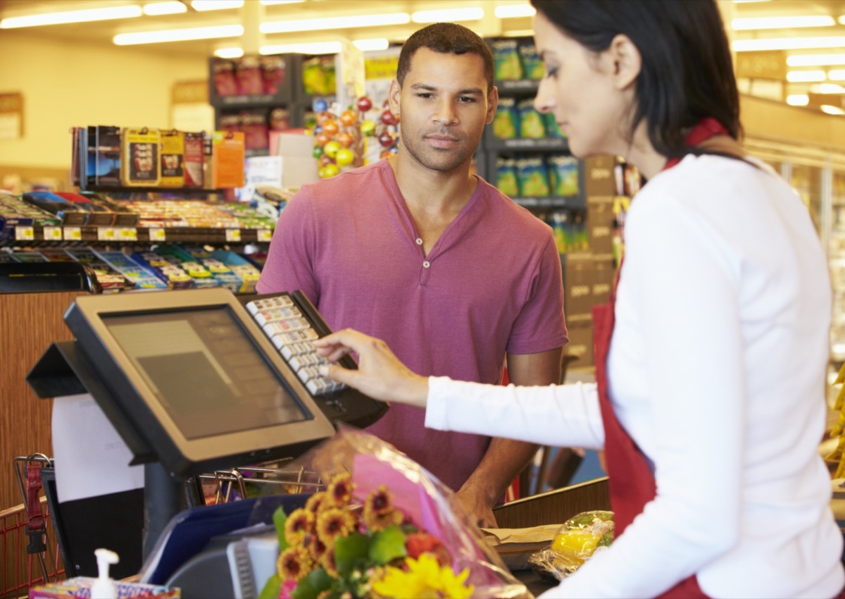 man getting carded at the store