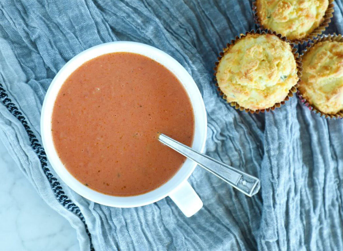 bowl of tomato soup with biscuits