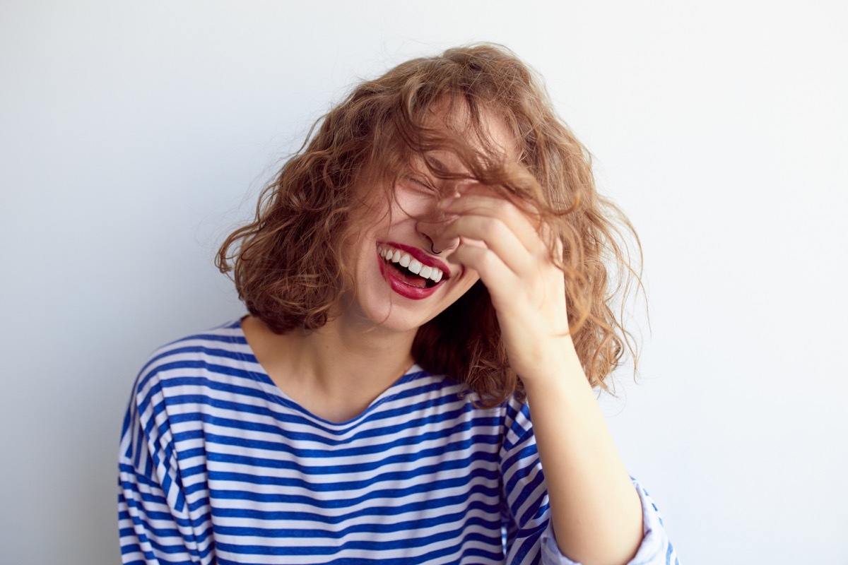 woman laughing to herself, what do you call jokes