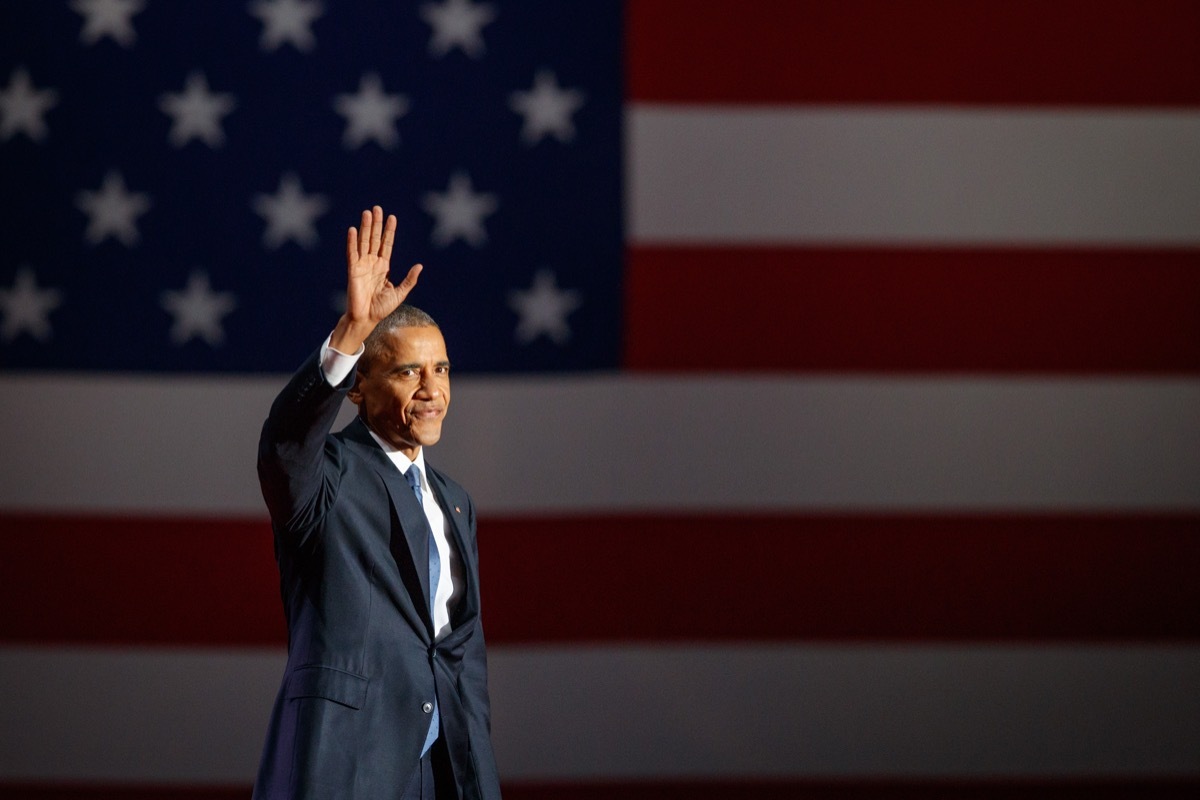 Barack Obama waving American flag