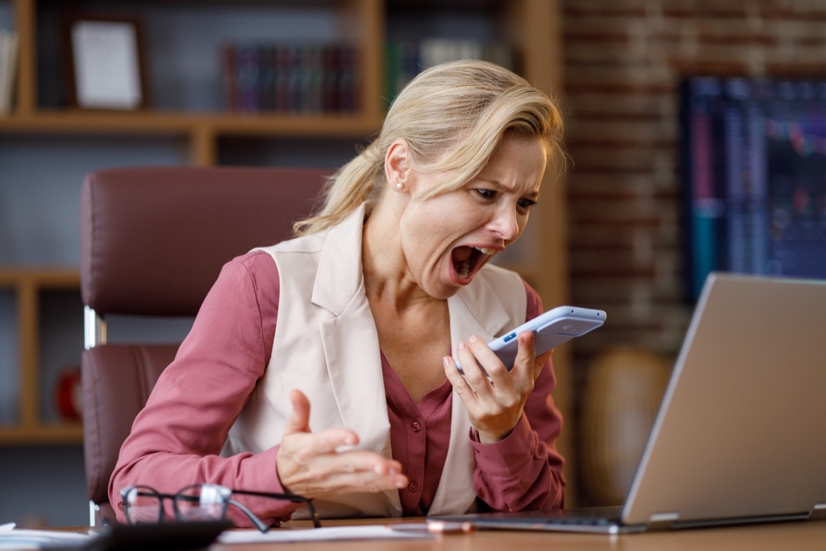 Woman Yelling on the Phone while Working