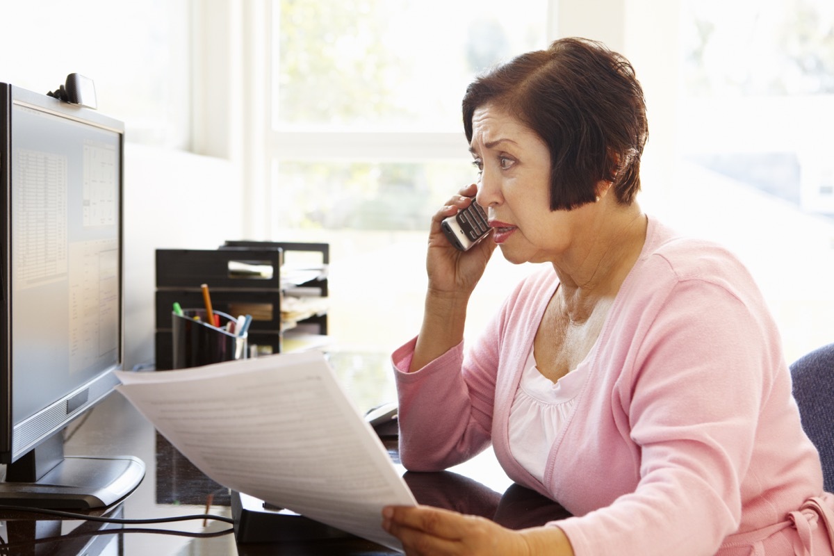 middle aged hispanic woman on phone