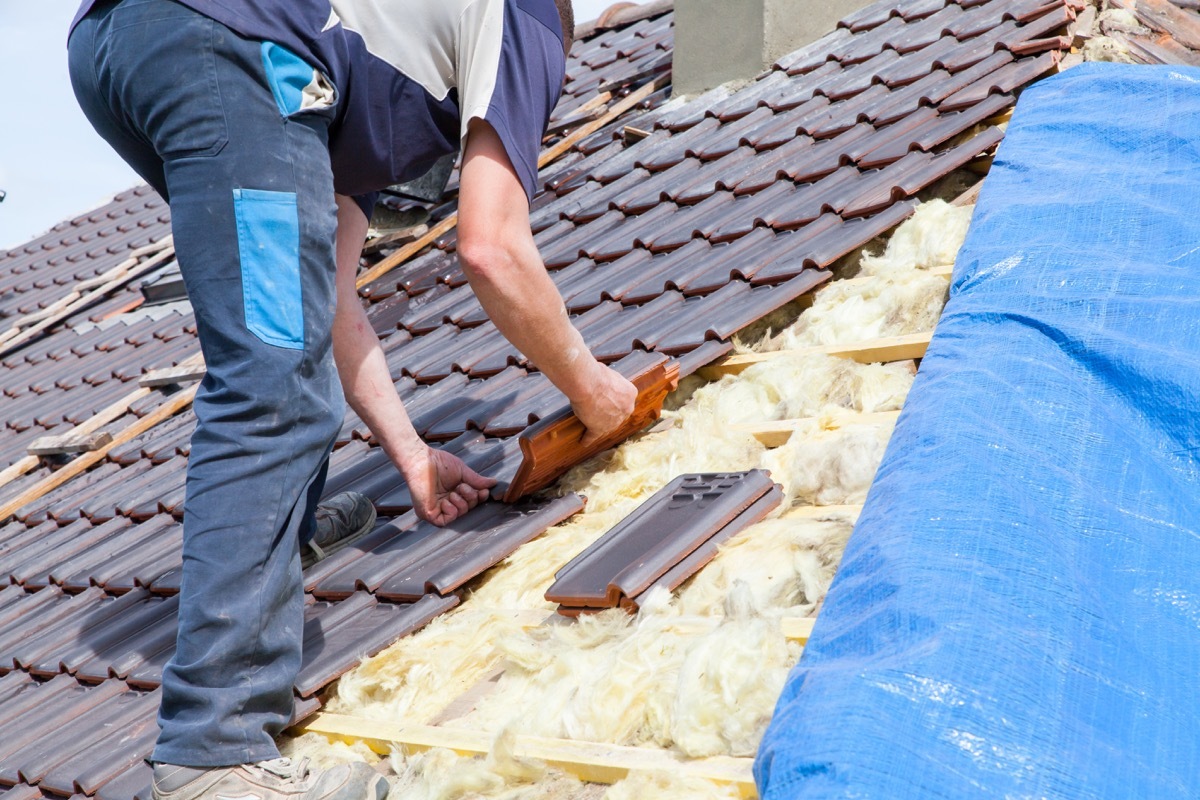 Man Installing a New Roof home upgrades with best return