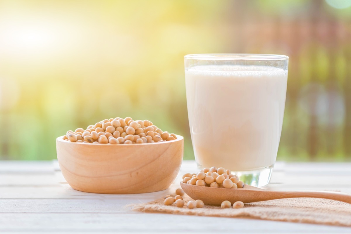 soy milk and soy beans on table