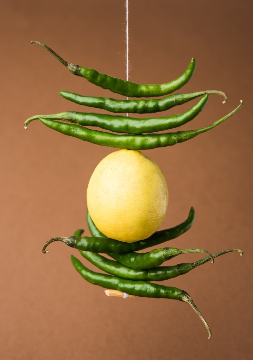 lemon and chili hung on a string