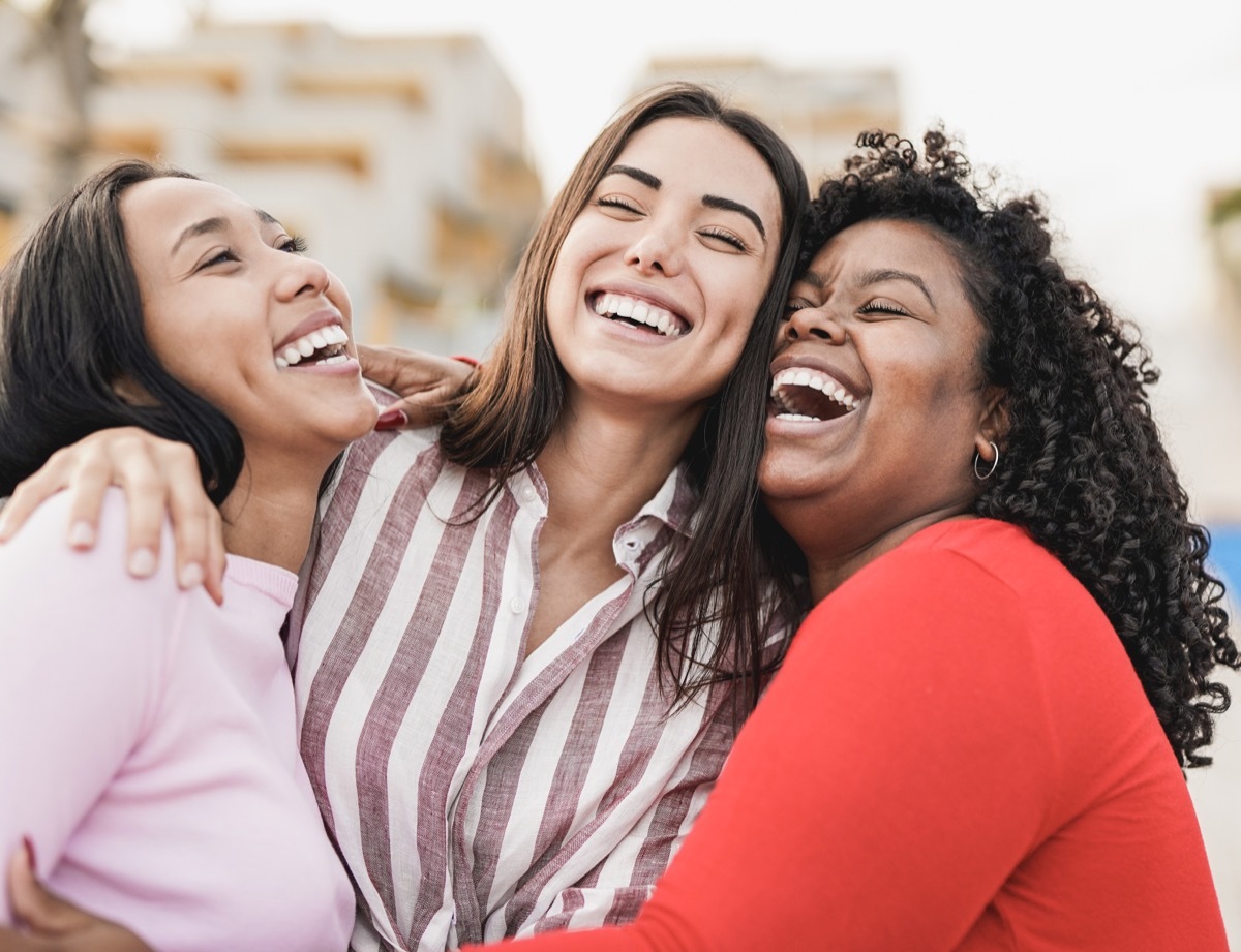 three female friends hugging