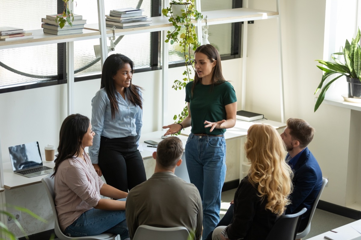 Two Coworkers Leading a Discussion