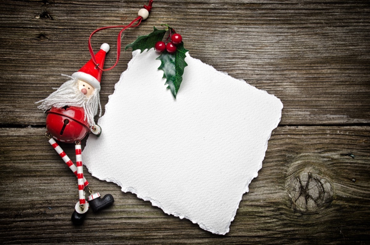 christmas card on wood with christmas ornaments