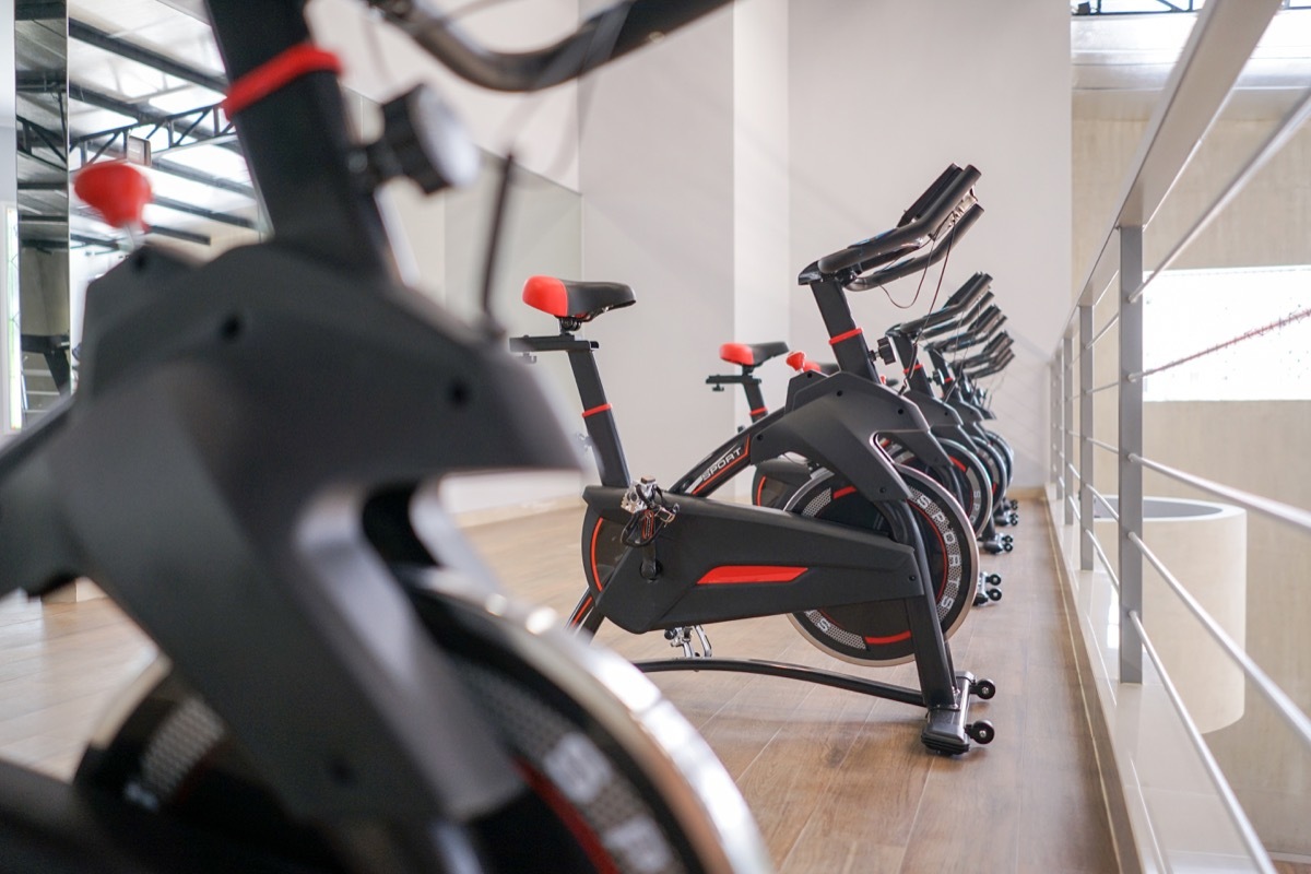 exercising bike at indoor gym in a row