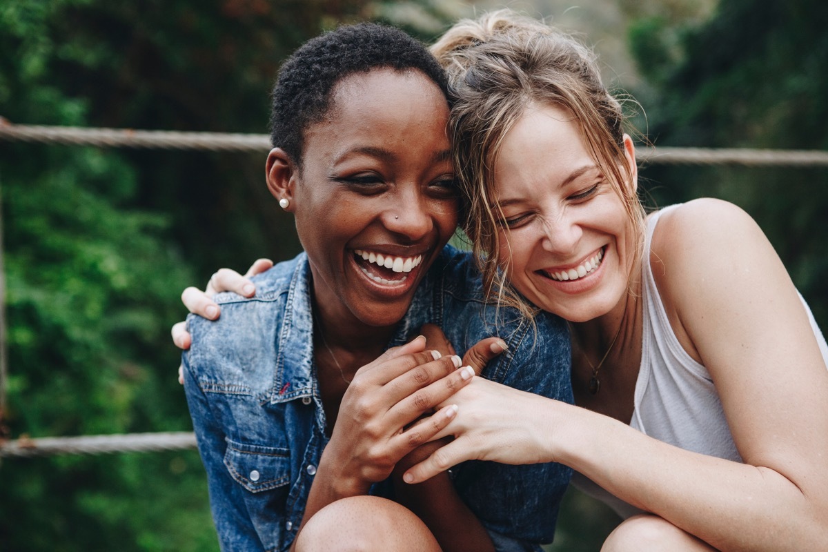 Two women laughing together