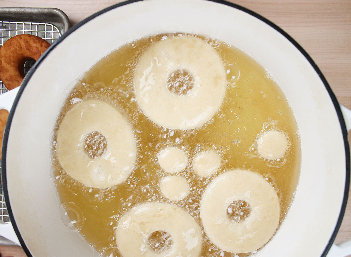 donuts frying in a dutch oven