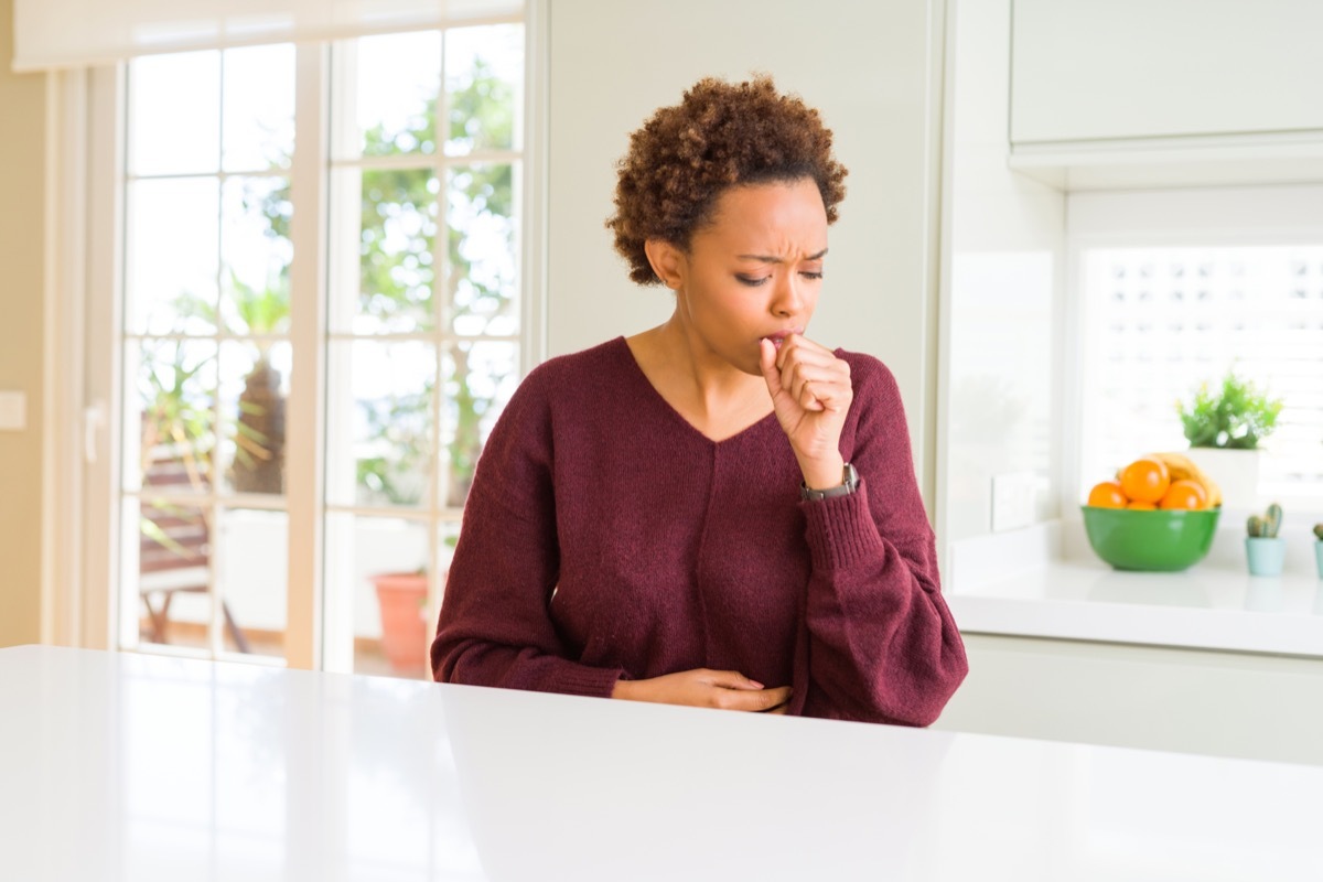 40-something black woman coughing