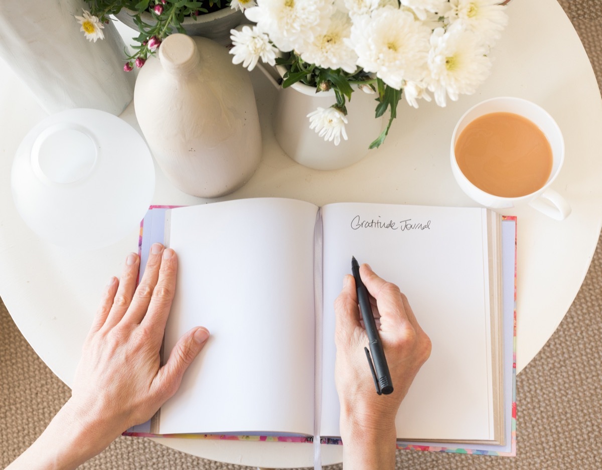 Woman using a gratitude journal