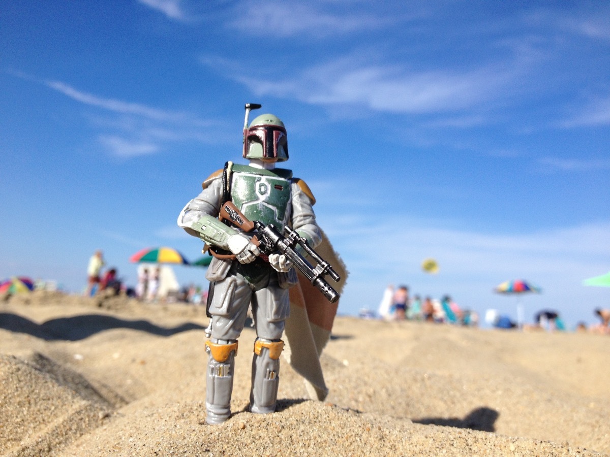 AVON, NEW JERSEY: AUGUST 15, 2013: Star Wars figure of Boba Fett on a beach. - Image