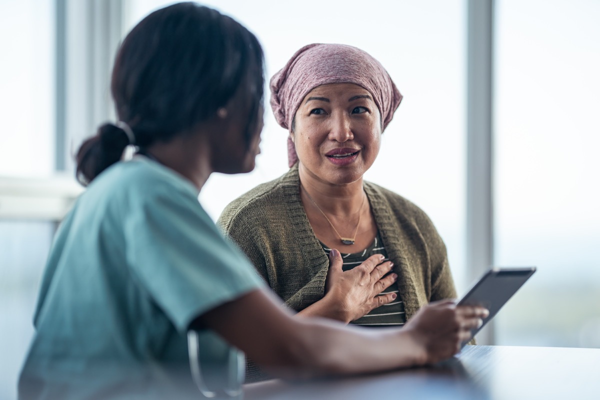 an older woman talking to her doctor while in the office