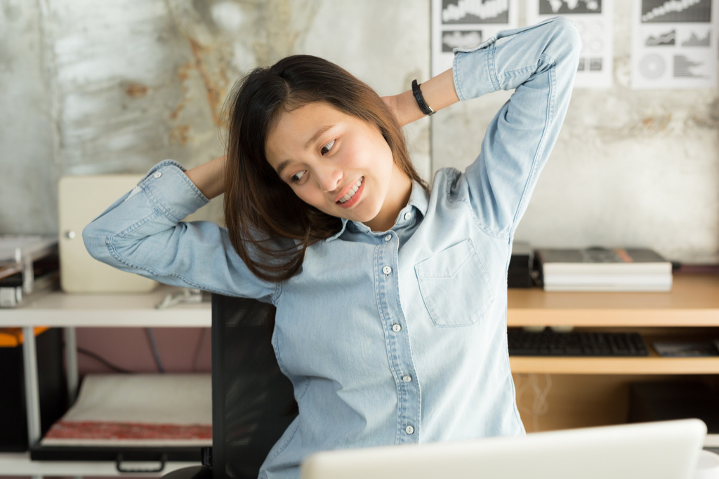 Woman Stretching in Chair 