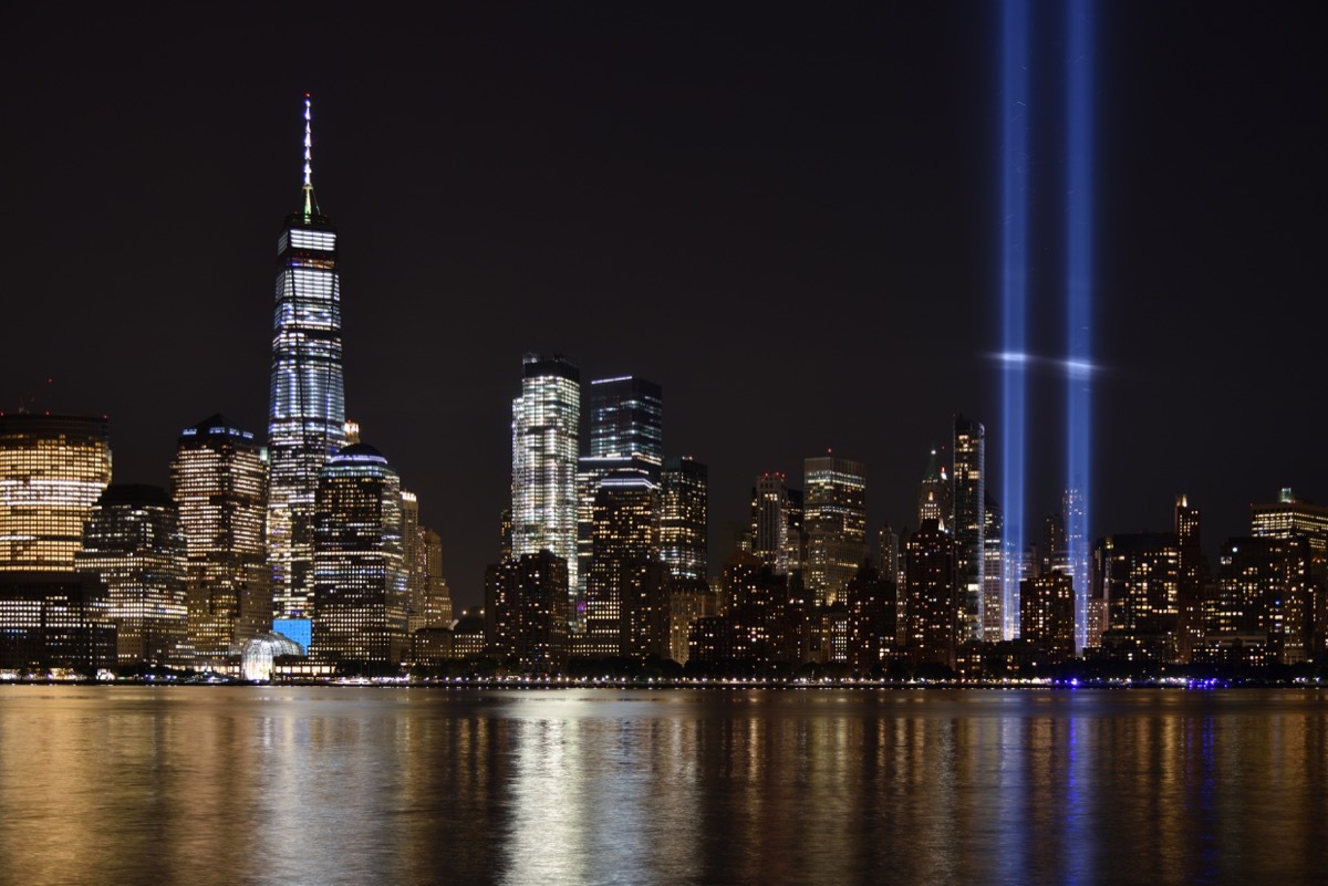 The 9/11 Tribute in Lights temporary monument in lower Manhattan dominates the city skyline